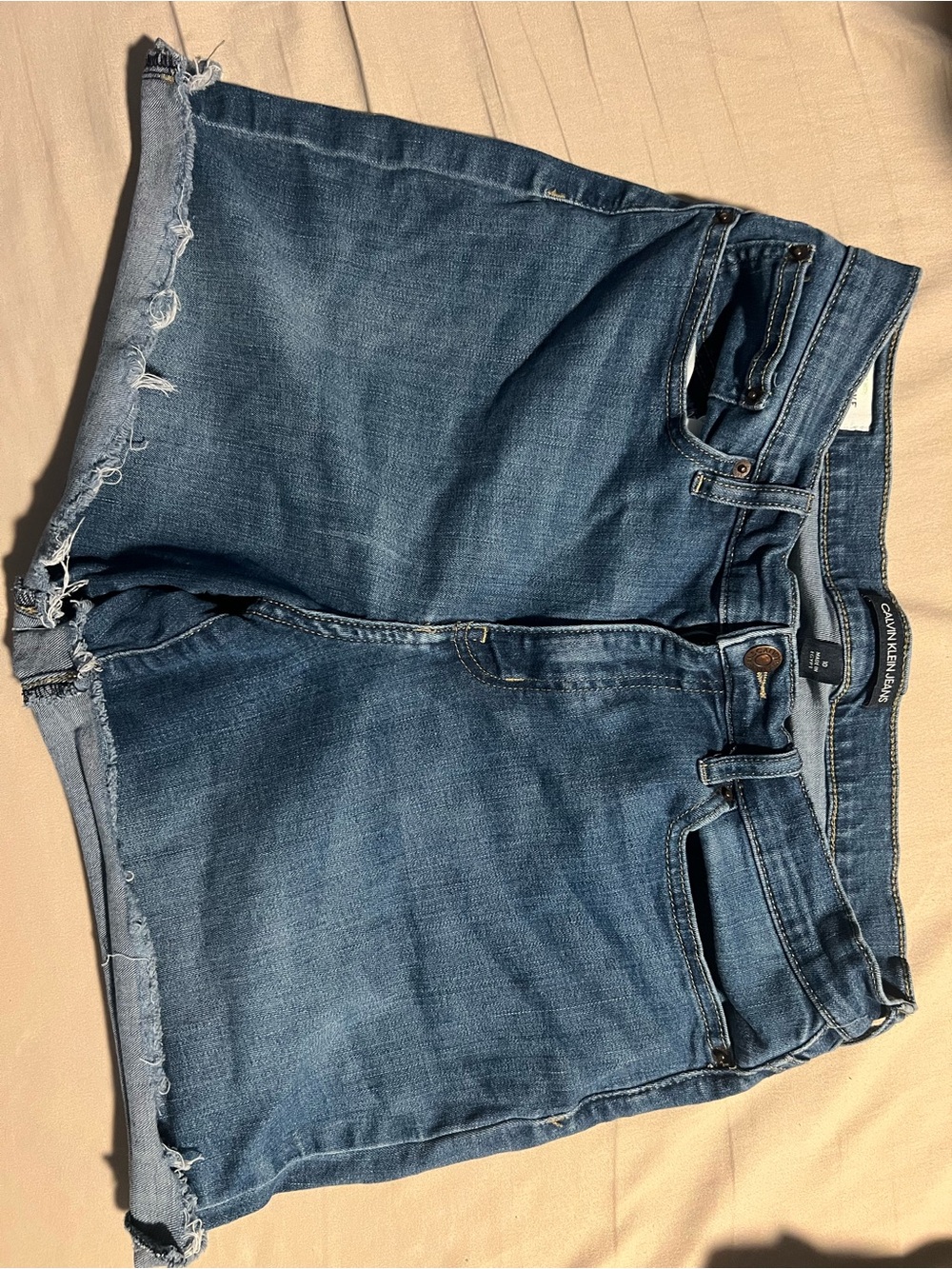 Calvin Klein Jeans Distressed Denim Shorts in Medium Blue